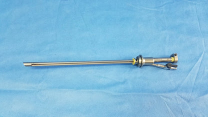 Silver metallic working insert a42091a with long slender shaft and articulated jointed end in sterilization tray