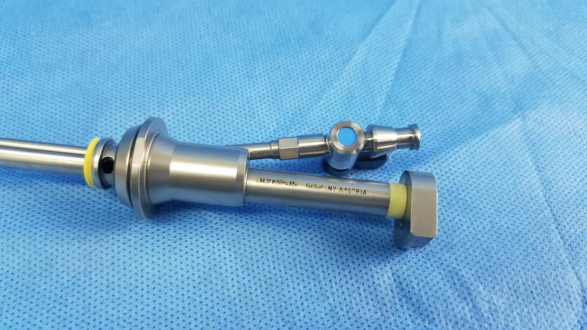 Stainless steel working insert with yellow gyrus acmi silicone seals and blue circular component for hystero-resectoscope