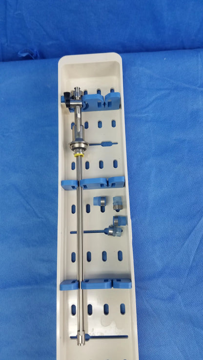 Silver surgical instrument set with blue gyrus acmi silicone seals arranged in white sterilization tray for working insert