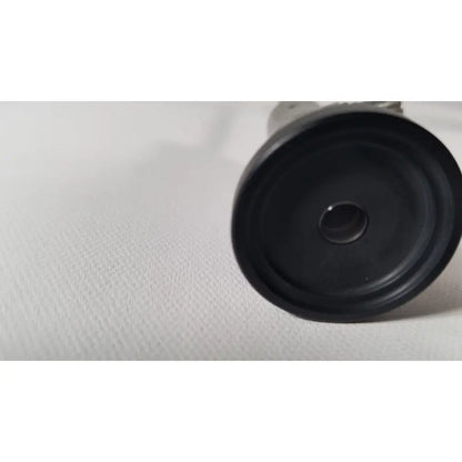 Black rubberized circular base with central hole and concentric ridges of olympus a4629a hd laparoscope accessory