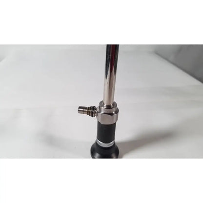 Shiny chrome olympus a5254 10mm laparoscope with black rubber grip and metallic joints for medical use