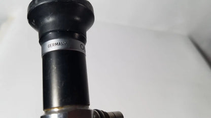 Black rubberized nozzle with a silver band inscribed germany on the olympus a5254 10mm 0 degree laparoscope