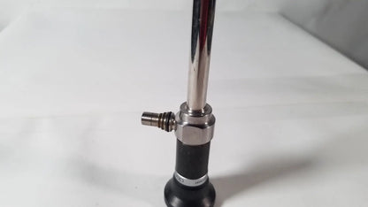 Shiny chrome olympus a5254 10mm laparoscope with black rubber grip and metallic joints for medical use