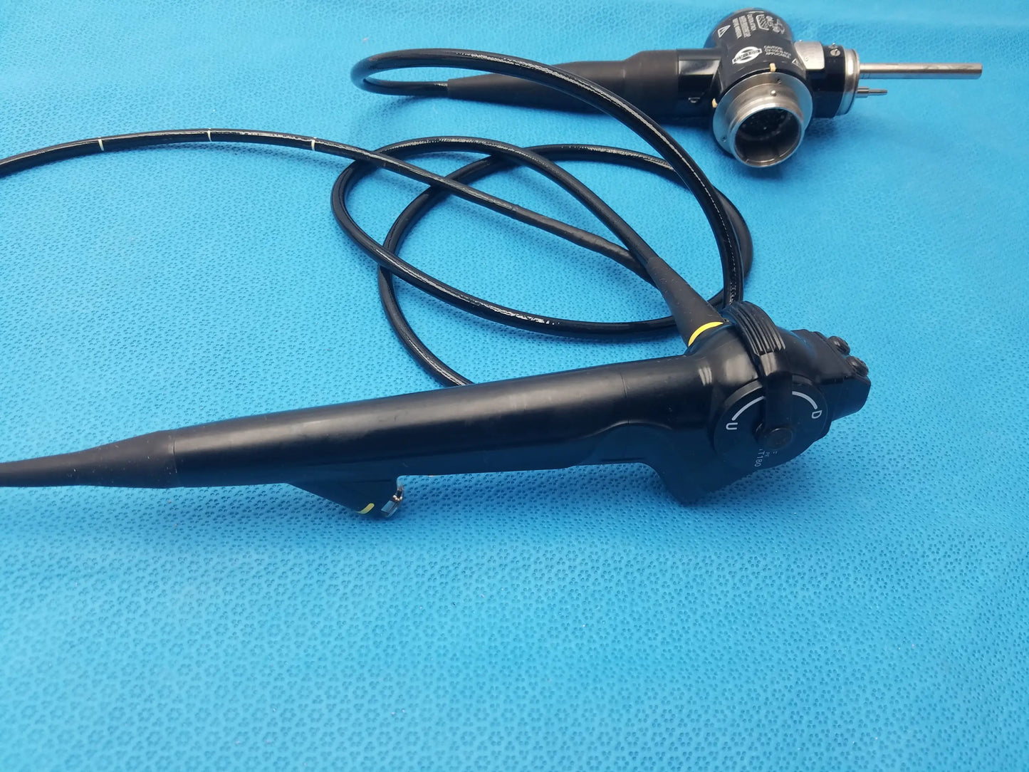 Black Olympus Evis Exera type 1t180 video gastroscope with flexible cable and control knobs for medical use