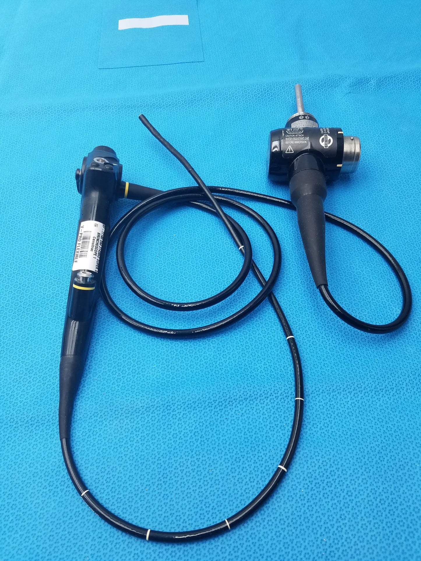Black olympus evis exera type 1t180 video gastroscope with flexible coiled cable and metallic control unit components