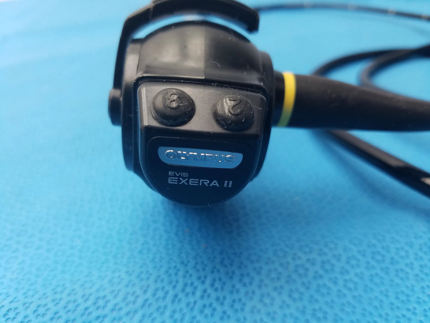 Black olympus evis exera ii type 1t180 video gastroscope with yellow band near handle for medical endoscopy use