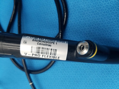 Black censitrac super d bronchoscope with silver metallic connector and yellow ring in olympus evis exera type 1t180 model
