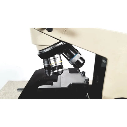 Beige and black olympus bh-2 binocular microscope featuring metallic lenses for advanced laboratory use