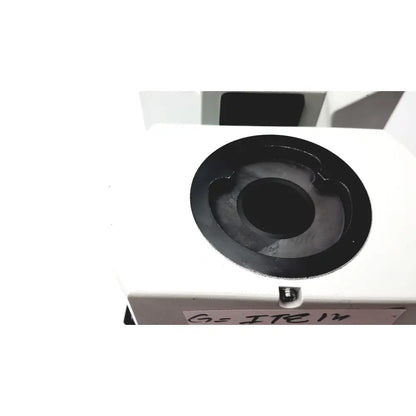White rectangular olympus bx51tf microscope with black circular opening and small screw showing some body damage