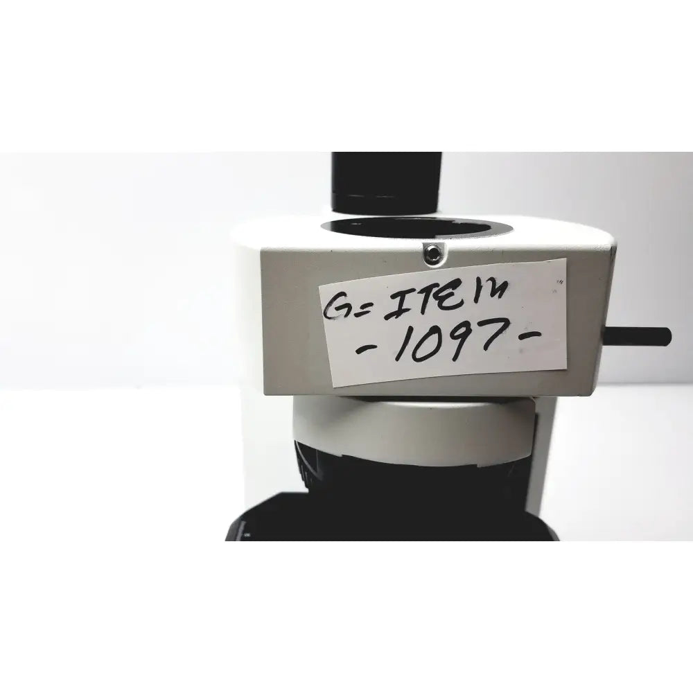 White and black olympus bx51tf microscope with handwritten label item -1097- showing some damage on body, working condition