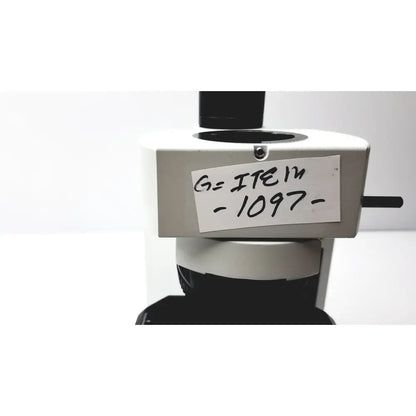 White and black olympus bx51tf microscope with handwritten label item -1097- showing some damage on body, working condition