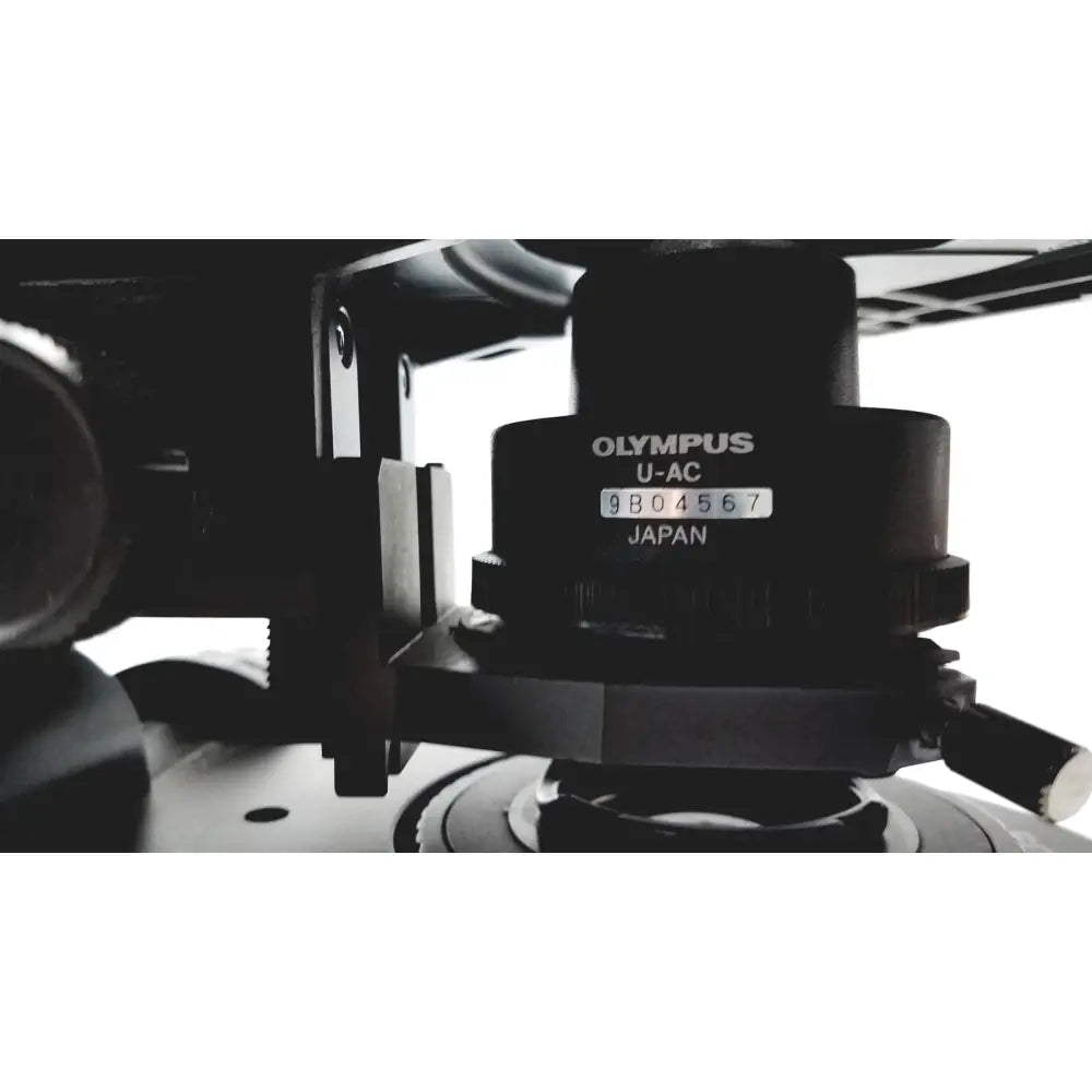 Black olympus u-ac camera tripod head with engraved serial number and japan marking on the olympus bx51tf microscope