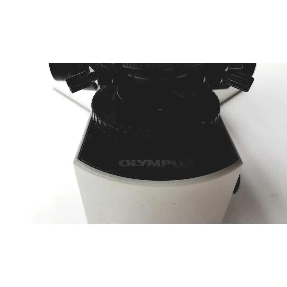 Black and white olympus bx51tf microscope base with matte finish showing slight body damage and fully functional