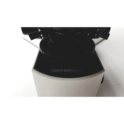 Black and white olympus bx51tf microscope base with matte finish showing slight body damage and fully functional
