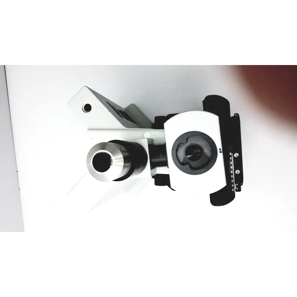 White and black olympus bx51tf microscope with metallic lens components showing some damage on body working condition