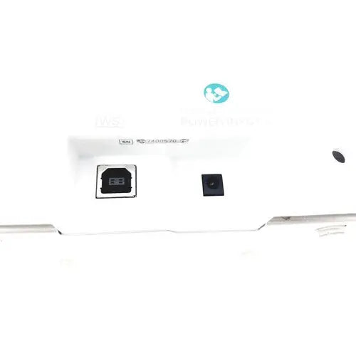 White xbox one s console showing black power and usb ports with olympus capsule recorder re 10 and maj 2032 cradle