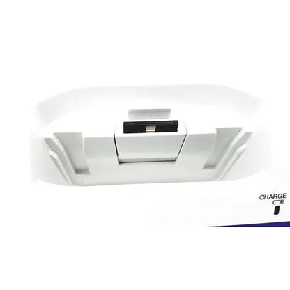 White plastic charging dock with black USB port and charge label for Olympus Capsule Recorder RE-10 cradle