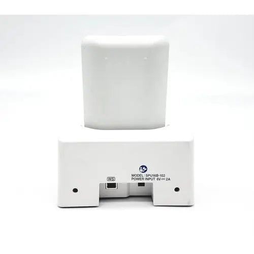 White rectangular battery charger with white cylindrical battery inserted for olympus capsule recorder re-10 cradle