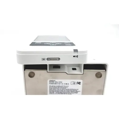 White plastic medical infusion pump with black control panel and metallic base for olympus capsule recorder RE-10 cradle