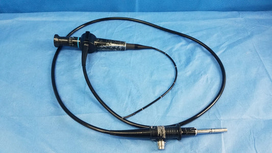 Black flexible fiber optic endoscope olympus enf-p4 rhino-laryngoscope fiberscope coiled on blue surgical drapes