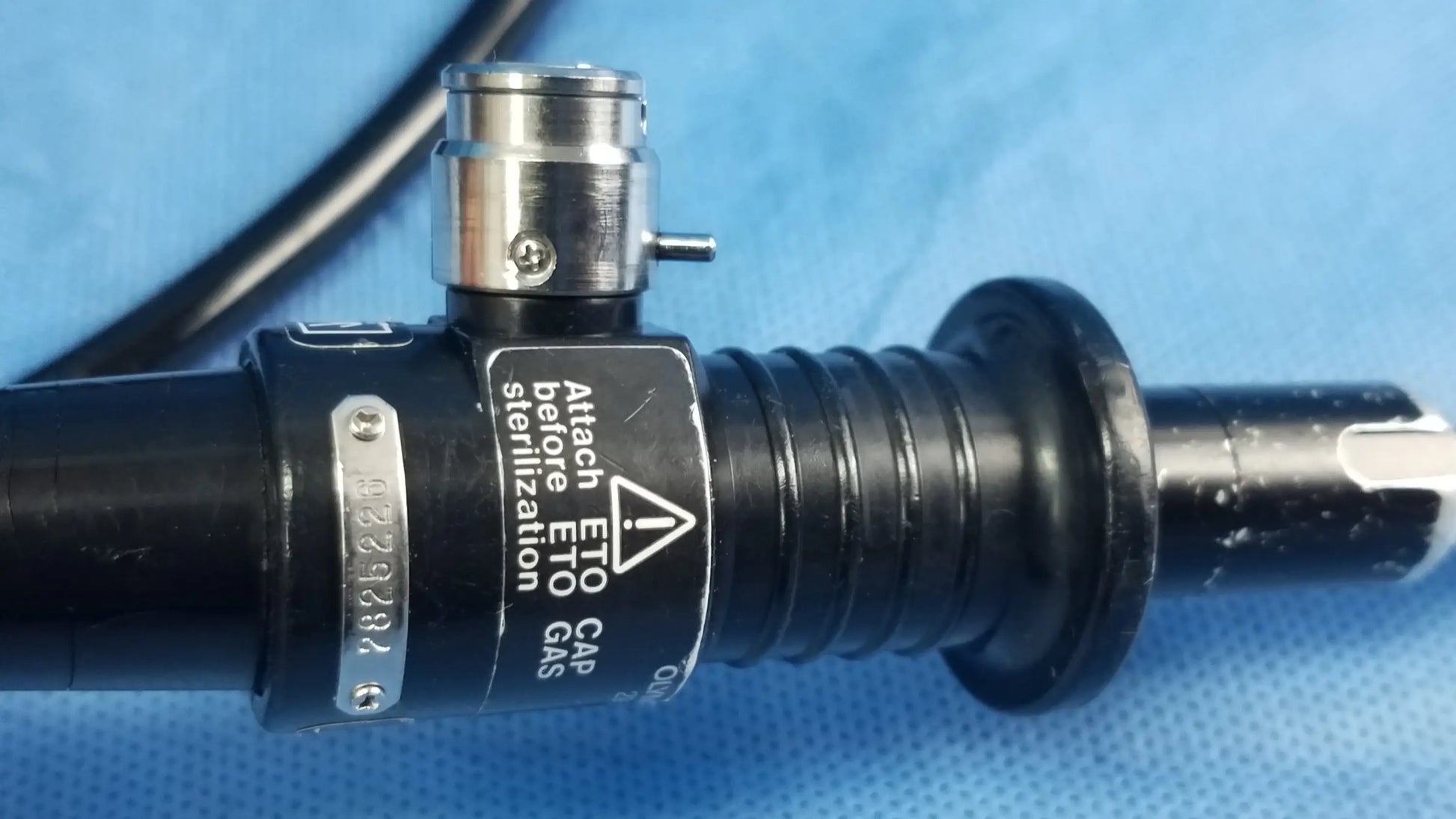 Black Olympus ENF-P4 rhino-laryngoscope flexible fiber optic endoscope with metallic connector and warning label visible
