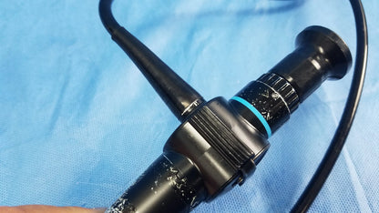 Olympus ENF-P4 rhino-laryngoscope flexible fiber optic endoscope with black body, blue accent ring, and textured grip