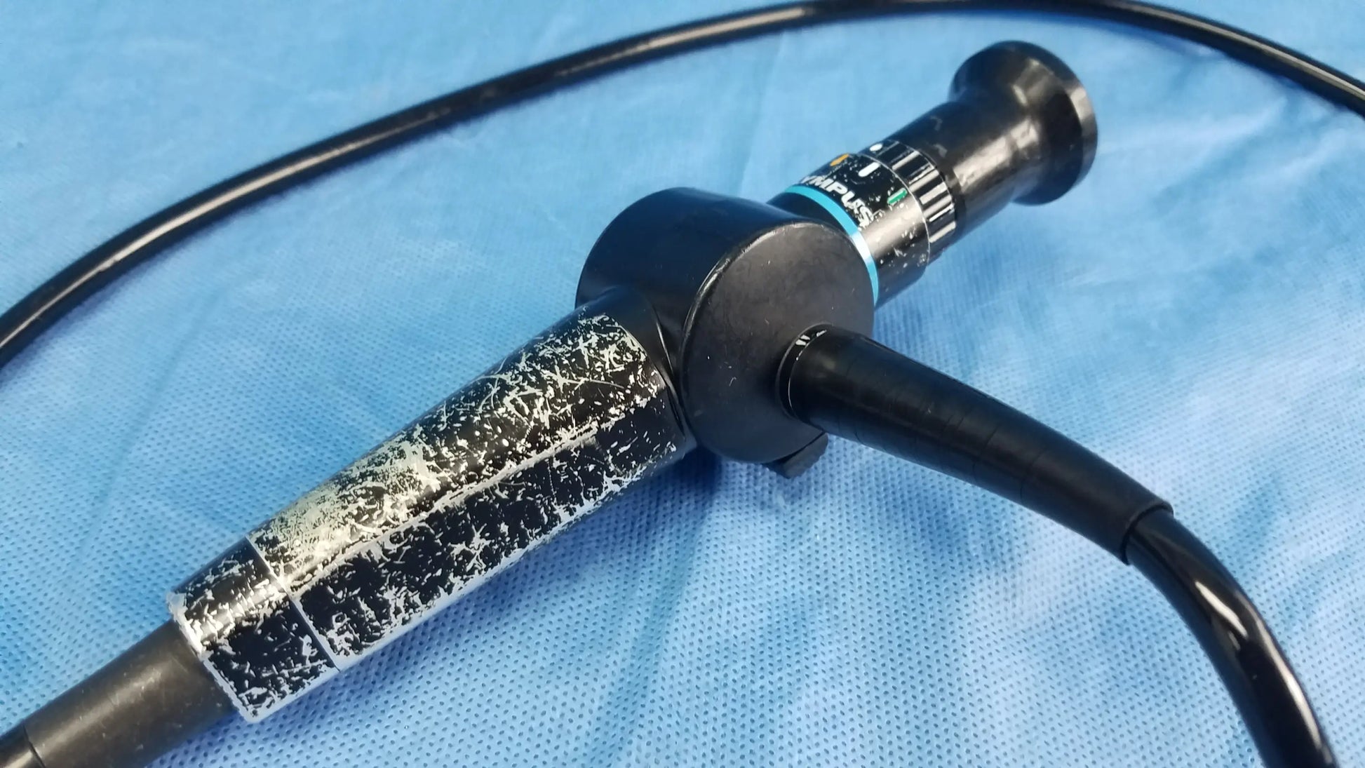 Olympus ENF-P4 Rhino-Laryngoscope flexible fiber optic endoscope with black body and textured silver-speckled grip section