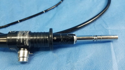 Black and silver Olympus ENF-P4 flexible fiber optic endoscope with metallic tip labeled invans systems corp