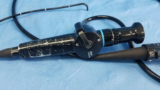 Black Olympus fiber optic endoscope rhino-laryngoscope type ENF-P4 with textured grip and labeled controls on blue drapes