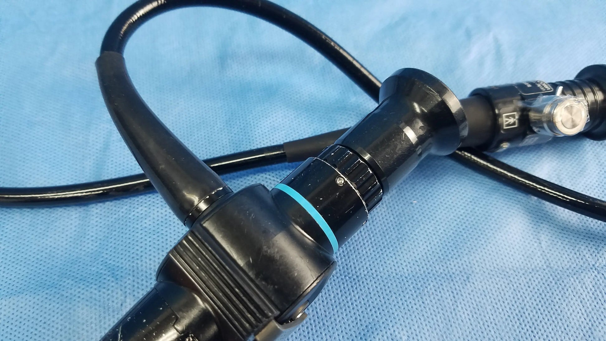 Olympus fiber optic endoscope rhino-laryngoscope ENF-P4 with black flexible fiber optic body blue accent ring and metallic knobs