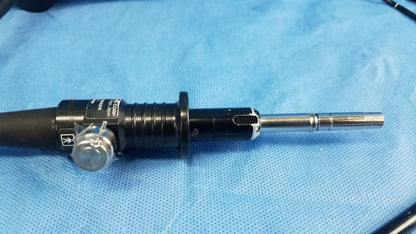 Black and silver Olympus fiber optic endoscope rhino-laryngoscope type ENF-P4 with textured grip and metallic tip
