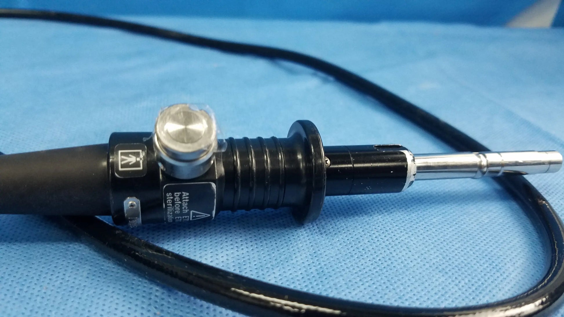 Olympus fiber optic endoscope rhino-laryngoscope type ENF-P4 with black silver textured grip and labeled control buttons