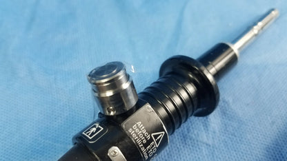 Black and silver Olympus fiber optic flexible endoscope rhino-laryngoscope with textured grip labeled attach before sterilization