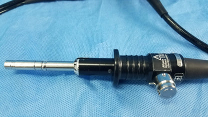 Black and silver Olympus fiberscope endoscope rhino-laryngoscope with textured grip, metallic tip, flexible fiber optic design, and control buttons