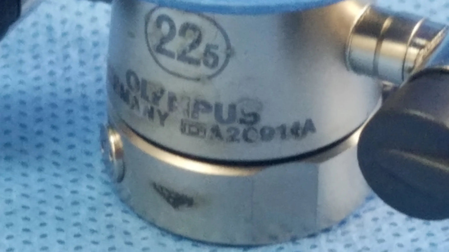 Silver metallic olympus germany a20914a 22.5fr cysto-urethroscope sheath with engraved markings and black knob endoscopic instrument component