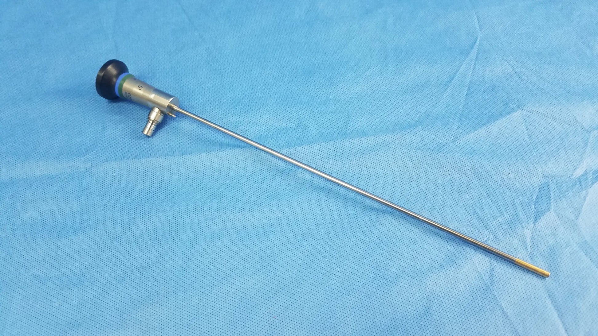 Silver surgical endoscope with black-tipped handle and metallic shaft compatible with olympus cystoscopic systems a22000a