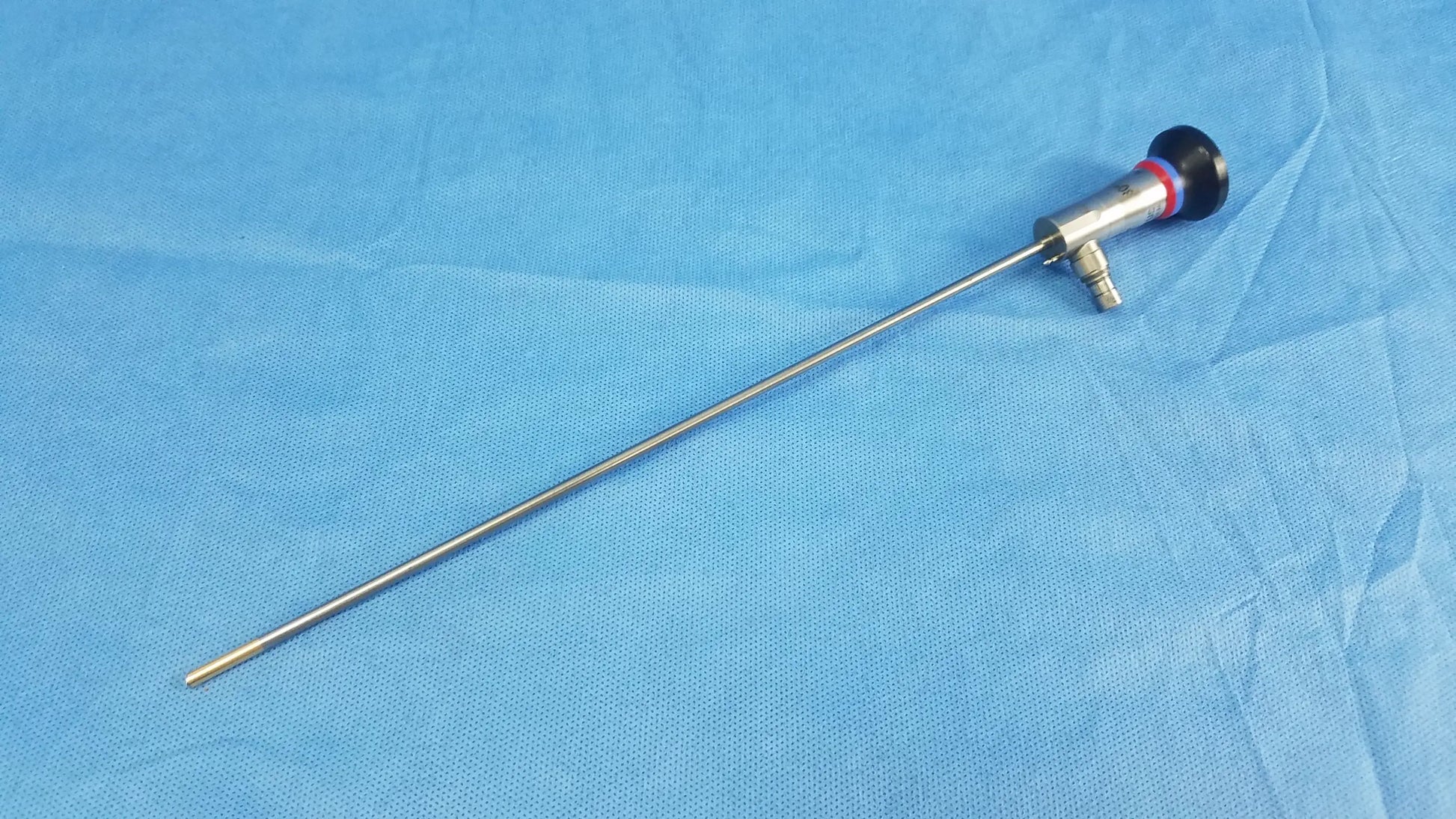 Silver surgical endoscope with black and red handle and slender metallic shaft compatible olympus cystoscopic a22002a system