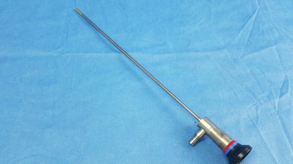 Silver surgical endoscope with black handle and red accent ring compatible with olympus cystoscopic systems a22002a