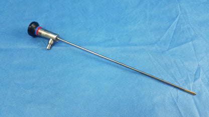 Silver surgical endoscope with black and red handle and slender metallic shaft compatible with olympus cystoscopic a22002a system