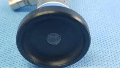 Black rubberized base with central perforated disc attached to metallic cylinder of olympus germany a22003a rigid telescope compatible with olympus endoscopic systems