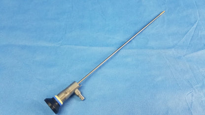 A metallic rigid telescope with a slender shaft and black blue silver handle compatible with Olympus endoscopic systems