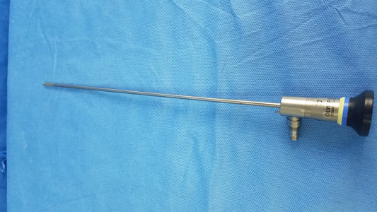 Silver surgical rigid telescope with black and yellow handle and metallic shaft compatible with Olympus endoscopic systems