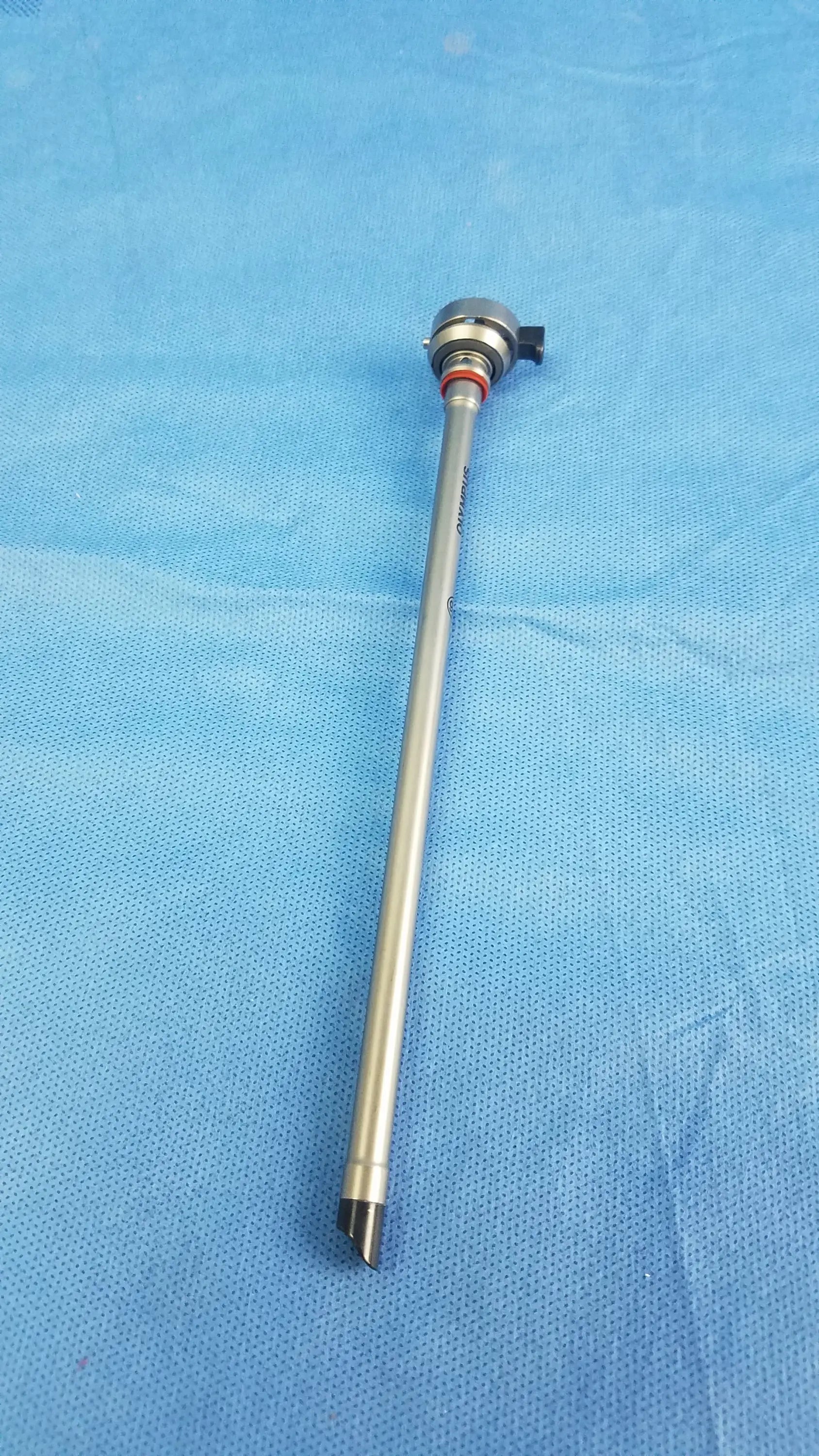 Silver metallic 26fr resection sheath instrument component with slender shaft black-tipped end and small black knob from olympus germany
