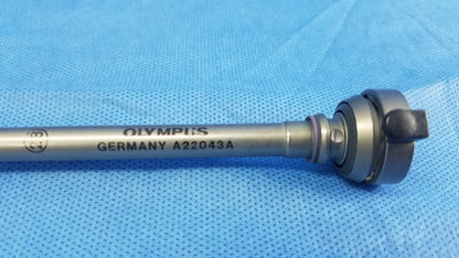 Silver metallic Olympus Germany A22043A 28Fr resection sheath with engraved marking and black plastic knob instrument component