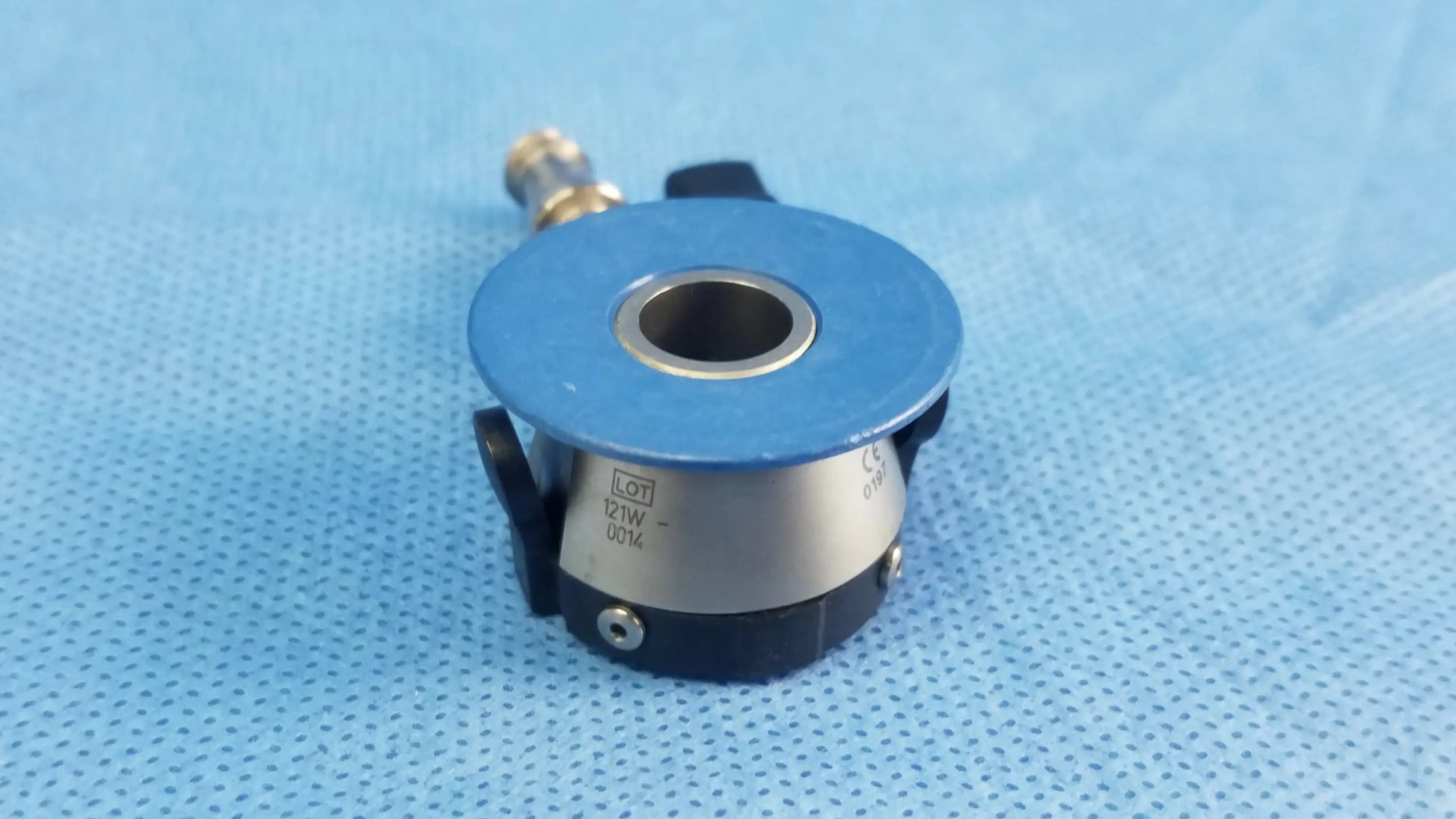 Blue and silver industrial sensor with black accents and threaded connection for compatible Olympus irrigation port endoscopic instrument component