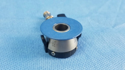 Blue and silver industrial sensor with black accents and threaded connection for compatible Olympus irrigation port endoscopic instrument component