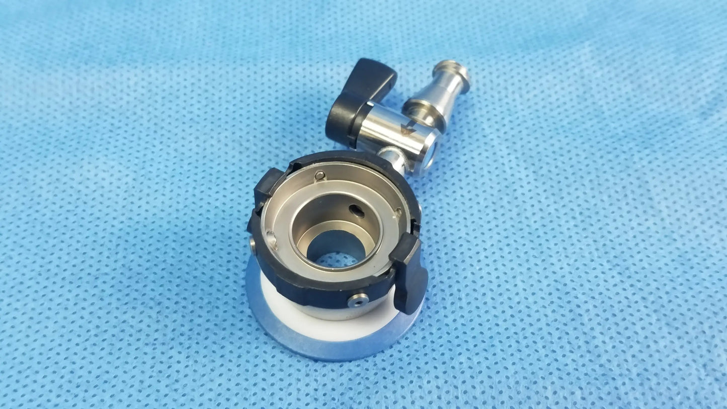 Silver and black irrigation port surgical instrument with rotating handle and threaded connection compatible olympus endoscopic instrument component