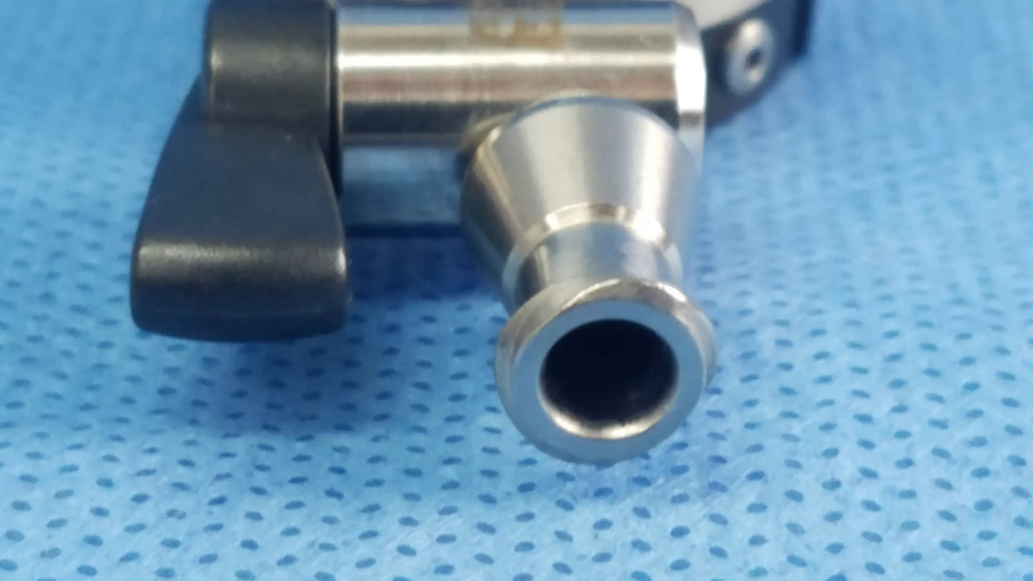 Silver metallic irrigation port with black plastic handle and threaded connection compatible Olympus endoscopic instrument component