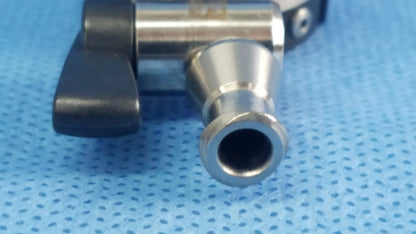 Silver metallic irrigation port with black plastic handle and threaded connection compatible Olympus endoscopic instrument component