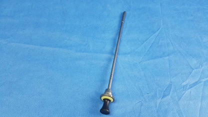 A slender metallic standard obturator instrument component with black ergonomic handle and yellow accent ring compatible Olympus